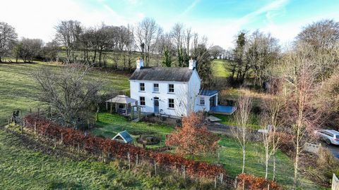 Fine and Country West Wales presents Caeglas, a three-bedroom country house situated at the end of a quiet lane near Llangeitho, West Wales. The property, maintained and extended by its current owners, offers panoramic countryside views and emphasize...