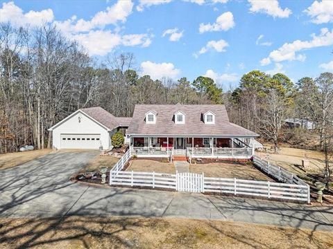 Nestled in a tranquil setting away from the road, this property exudes serenity, with deer and turkeys freely roaming the 5.5 acres! Large and mature trees dot the landscape, creating a wooded haven. The sunroom provides a picturesque view of the woo...