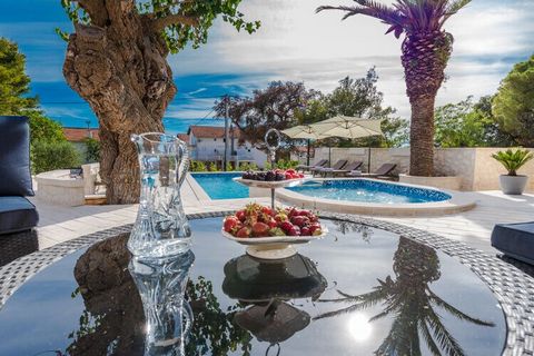 The villa is located in a beautiful large garden with a tempting large pool and a private children's playground. On the ground floor there is a beautiful open living, dining and kitchen area. On the ground floor there is also a large bedroom with a d...