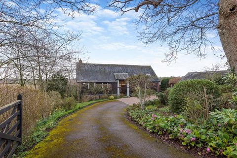 This imaginatively converted former barn oozes historic character yet has a contemporary, light and airy feel which makes it practical for modern living. It boasts a highly desirable location approximately four miles north-west of Monmouth in the ham...