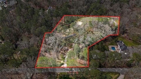 Exclusive opportunity to acquire a prime estate lot in the Chastain/Buckhead/Sandy Springs area. This exceptional parcel, meticulously prepared for your custom residence, awaits amidst the serenity of a gated entrance and an artisanal stone bridge ma...