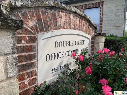 NOW AVAILALBE! Rarely do these come up for sale in the desirable Double Creek Office Condominiums. This spacious 4 private room condo with open lobby area and ADA compliant bathroom is where you can set up your own small business, law office, insuran...
