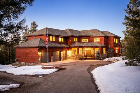 Nestled in the heart of Conifer's highly coveted mountain community, this custom built contemporary home offers unparalleled luxury living amidst 10 acres of breathtaking natural beauty. Rarely does a home in prestigious Conifer Ridge become availabl...
