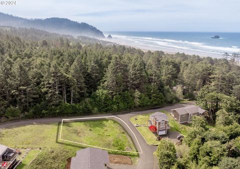 Welcome to your escape in the coveted Castle Rock Estates at Arch Cape. Corner Lot 13 is the perfect canvas for you to build your dream home with a peek-a-boo view of the ocean from a second story window. Enjoy the serenity of small town beach life w...