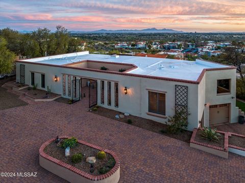 BUYER'S FINANCING FELL THROUGH! Catalina Foothills property on elevated lot with unobstructed city and Mountain views! Bright and spacious floor plan with a picturesque wall of windows over looking the city of Tucson. Huge primary suite with beautifu...
