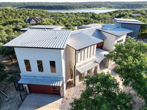 This is your opportunity to own a custom, self-sufficient Texas home that seamlessly blends luxury and sustainability. Owned by a former writer and entrepreneur, this custom home welcomes incredible inspiration with Hill Country Lake Georgetown views...