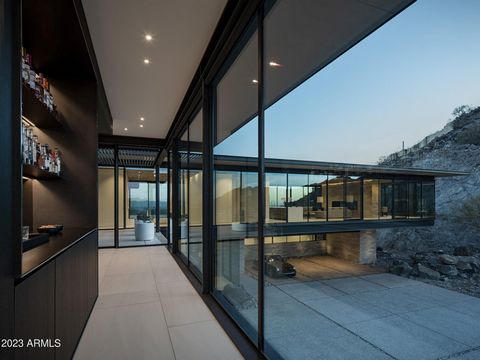 Perched between two mountain peaks, the Upper Ridge Residence is an exquisite 8,000 +/- sf custom home, designed and built by The Construction Zone ... The home is a modern steel and glass pavilion that reaches the highest level of fit and finish in ...