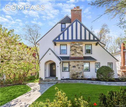 Totally redone with a very contemporary style and only steps from the Bronxville school, train and village center sits 25 Parkway Road. A handsome Tudor with all new stylish bathrooms, new eat-in kitchen looking out over an expansive lawn, new floors...
