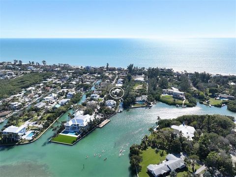 $200,000 PRICE REDUCTION! Welcome to waterfront living on Longboat Key. This elevated canal front home (2800SF main living level and 5300SF total) with private elevator offers an exceptional combination of spaciousness, tranquility, tropical living a...