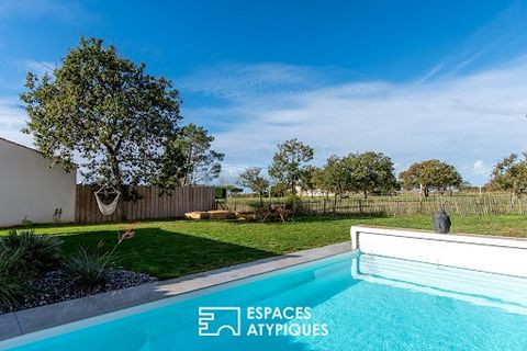 In the town of Brem-sur-Mer, this property with 202 sqm of living space is set on land of more than 1100 sqm. This contemporary house built in 2020 is a haven of peace due to its design around a large garden area with swimming pool, not overlooked an...
