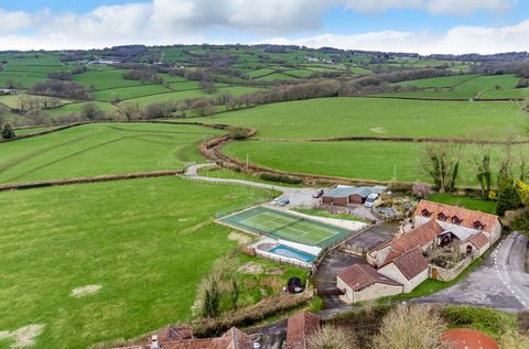 Orchard Barn presents an exceptional lifestyle and equestrian opportunity, unlike any other. This stunningly converted 5-bedroom stone barn is nestled within nearly 12 acres of picturesque countryside of the Blackdown Hills. The property overlooks it...