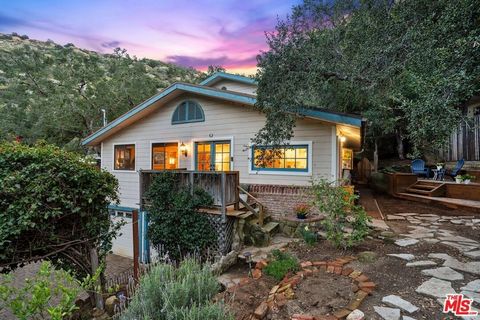 Welcome home to this super charming 4 bed / 2 bath 2-story home with views in the heart of Santa Susana Knolls in prime Simi Valley! As you enter through the beautiful gated bougainvillea archway, a stone stairway and path leads you to this storybook...