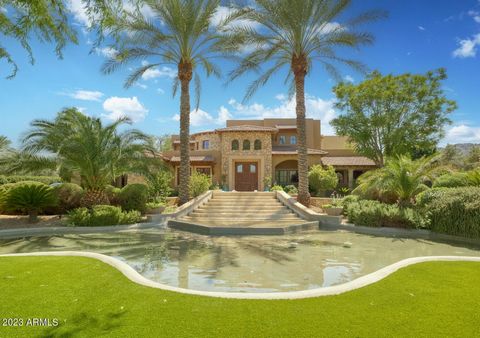 Welcome to the palatial ''Casa Bello Vino'' estate. The remarkable 9.5 foot carved wooden door opens to a home with intricate design and impressive details. The herringbone travertine graces the walkways as you make your way to the extraordinary 2 st...
