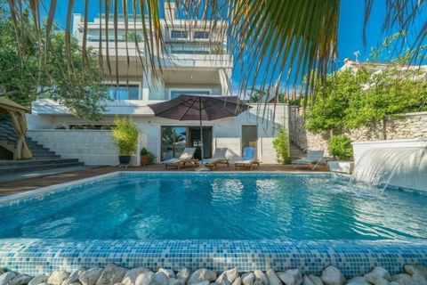   Beautiful modern seafront villa of 5-star standard with the gates directly to the beach and swimming pool!   Ideal combination of glass and stone in villa decoration, spacious terraces overlooking the sea make it really a pearl of Adriatic! 