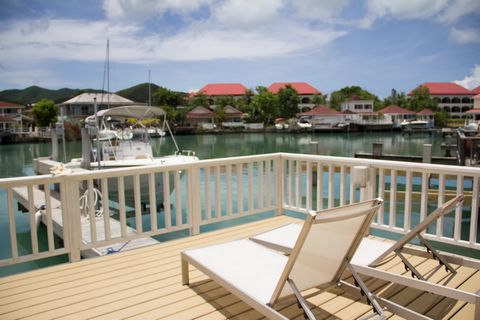 Located in Jolly Harbour. This lovely, modern 2 bedroom 2.5 baths is located in the gated community of Jolly Habour. Just a few steps away from the turquoise beach, along with an abundance of amenities, including an international supermarket, restaur...