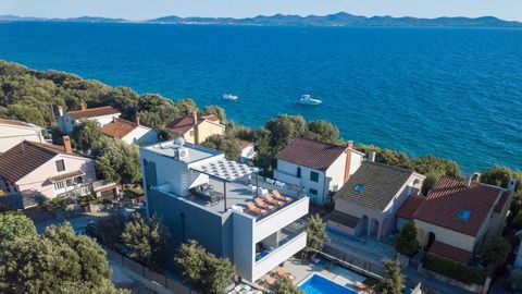 HOT SALE! Price went down from 1,2 mln to 1,1 mln eur! Beautiful modern second line villa in Zadar area, in Kozino, just 30 meters from the sea! Fantastic sea views area opening from this wonderful villa! Total area is 230 sq.m. Land plot is 493 sq.m...