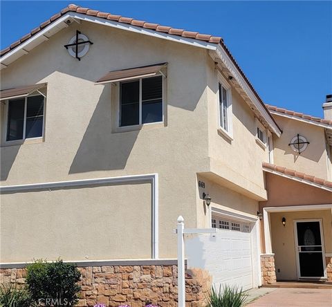 Welcome to this delightful 3-bedroom, 2.5-bathroom home nestled within a gated community in Riverside. As you approach the front door, the newly tiled entryway invites you inside. Step through, and you’ll discover a warm and inviting interior with th...