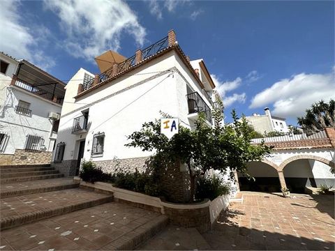 Exclusive to Us. Is this beautifully renovated townhouse with 3 bedrooms, 2 bathrooms and an amazing roof terrace with summer kitchen located in the white village of Periana in the province of Malaga, Andalucia, Spain. We enter the house in the loung...