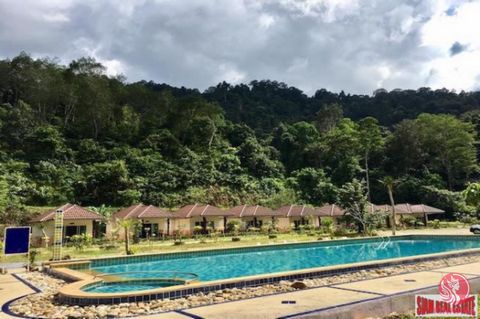 This rustic resort is surrounded by a stream and is for sale in Phang Nga. Located in the most popular rafting area in Thailand this 10 Rai of land is available on Sorporkor title. The resort has a cool stream flowing through it and is private and qu...