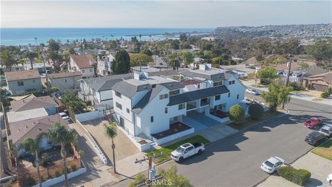 PANORAMIC OCEAN VIEW DUPLEX! A Rare INVESTMENT OPPORTUNITY! FULLY REMODELED tri-level duplex offering breathtaking views from Dana Point Harbor to San Clemente, located just 5 BLOCKS from Doheny State Beach. This exceptional property features 2 ident...