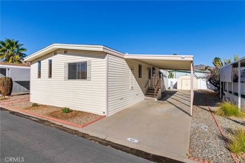 This charming two-bedroom, two bathroom mobile home in the desirable El Sorrento 55+ Community offers a blend of comfort and functionality. The home features a spacious living room and dining room with built in cabinets for additional storage and dis...