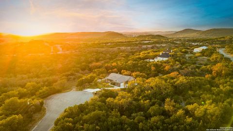 Experience the best of Hill Country living in this stunning single-story home in the gated Dancing Bear community. Set on a sprawling 1.45-acre lot, this property offers a seamless blend of luxury, functionality, and natural beauty, all within easy r...