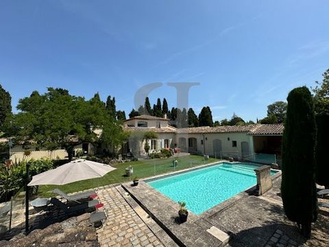 SAINT REMY DE PROVENCE Rare, close to the town centre, in a quiet environment, come and discover this prestigious property of approximately 285 m2 with its outbuilding. The house will seduce you with its beautiful volumes, its old fireplaces, its iro...