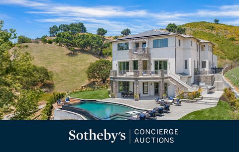 This gorgeous, brand-new three-story construction home in Calabasas combines clean modern lines with natural materials that highlight the natural surroundings and breathtaking panoramic views. The dramatic front entry features a contemporary fountain...