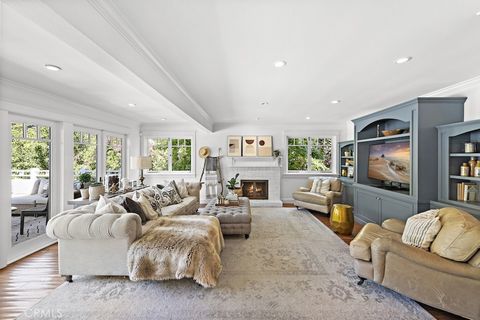 Located on an expansive lot in Laguna's desirable Lower Bluebird Canyon, this stunning coastal cottage boasts a functional layout spanning three levels, complete with 5 bedrooms (currently configured as 6) and 4.5 baths. Meticulously remodeled by ren...