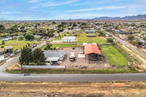 Discover the epitome of pride of ownership in this remarkable, irrigated, 1-acre horse property. Interior: Adjacent to the kitchen, the spacious living room provides a cozy retreat for relaxation and entertainment, boasting a fireplace and large wind...