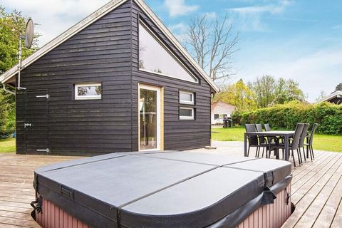 This is a special holiday cottage in a child-friendly area with a big, fine lawn where the children can go on the swings and have fun in the garden. Not far away from the cottage you can reach the beach by some steps. The cottage has also a big, wood...
