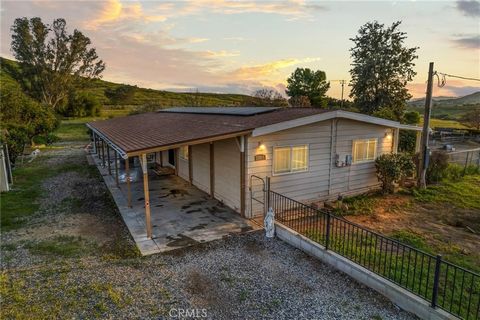 Welcome to your piece of paradise nestled on a sprawling acre of picturesque, flat, and fenced land, where the beauty of country living meets modern convenience. This charming three-bedroom, two-bath 1980 manufactured home is on a permanent foundatio...