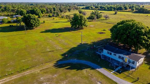 Situated on 9 acres. Fully fenced with spring fed pond, oak trees and pastures. This charming 3-bedroom 2 bath 2003 Palm Harbor manufactured double wide home is seeking those looking for a serene retreat for themselves and their horses and animals. G...