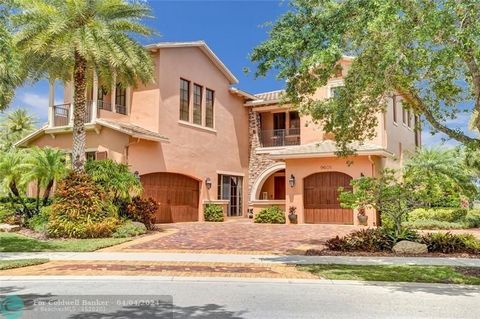 21,000 square foot (.5 acre) lot on this CORNER waterfront pool home in amazing Parkland Golf & Country Club. One of the Nicest Communities in Broward County. 4 Bedrooms upstairs- One used as a media room, 3 full baths upstairs, Loft/Game room & 2 pr...