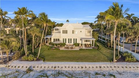 Step onto the white, sandy beach from your own Naples beach paradise. Boasting 6-bedrooms, 6.5-baths this timeless property is ready now for a lucky buyer's enjoyment. Capturing the essence of Bermuda Architecture, this beach house recalls the white ...