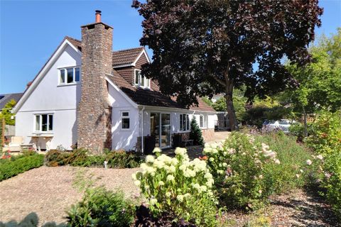 This delightful chalet style bungalow is tucked away in private setting close to the heart of this highly regarded Exmoor village set in mature level gardens with stream running through and with pleasant outlooks towards the church. Built in the earl...