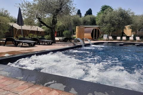 Holidays in the caravan park directly on Lake Garda, nestled between centuries-old olive trees. The mobile homes are modernly furnished and all have a covered terrace with garden. Your holiday resort offers amenities for the whole family: shared outd...