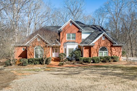 Welcome to timeless elegance and modern comfort in the prestigious Hodgson's Place subdivision. This stunning 4-sided brick home offers 5 spacious bedrooms and 4.5 luxurious bathrooms, providing ample space for family, guests, and work-from-home flex...