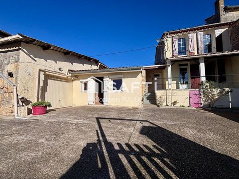 Maison en pierre mitoyenne : 2 chambres, jardin, garage et un potentiel studio !
