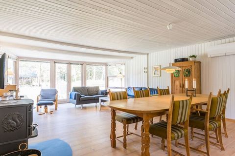 On the most beautiful plot in the middle of Houstrup Plantage and with the nicest wooden terrace, we have a really cozy cottage here. The white kitchen and living room are in open connection to each other and there is plenty of space for both cooking...