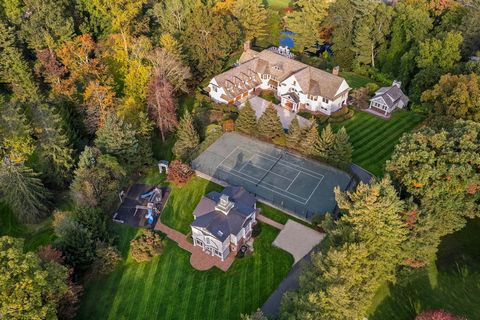 A private compound crafted by acclaimed architect Joeb Moore and constructed by Hobbs is discreetly positioned behind gates on 2.5 lush acres near town off lower Round Hill. This estate features 3 structures: a 6 bedroom shingle-style home, a 2 bedro...