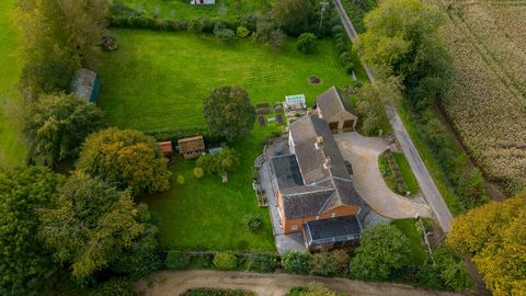 This spectacular and much extended former farmworker’s cottage must be seen to be believed. With total accommodation running to (2,400)sq.ft. and with stunning field views to front and back, it stands on a plot of (1.12) acres including a separate pa...