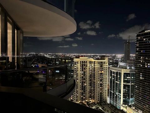 This extraordinary offer in Brickell Flatiron! Residence 4012 features sophisticated finishes and elegant modifications. The original study has been integrated into the master bedroom to create a grand suite with a hidden dressing room and sitting ar...
