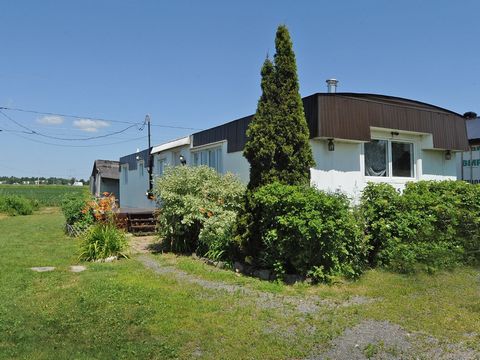 Own this property for the price of your rent... Mobile house offering 2 large bedrooms. Partially fenced rented land at 150$/month. Chimney installed for installation of wood stove if desired. Call me to know more! INCLUSIONS Fixtures, curtains and r...
