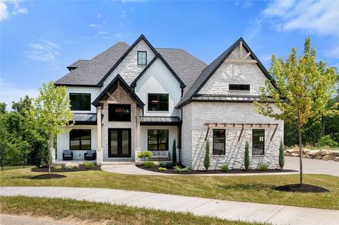 Striking Modern Elegant Farmhouse! Trendy yet timeless with gorgeous open floor plan and fine finishes throughout this modern mansion! Jaw dropping entry with designer lighting! Spectacular two story stone fireplace with firebox in this modern family...