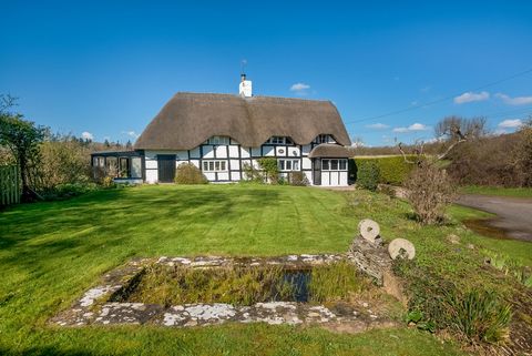 Open House Event | 13th April and 16th April | Viewings by Appointment Only A highly desirable Grade II Listed thatched cottage close to the town centre. With four double bedrooms, one en-suite, family bathroom, large lounge, dining room, snug, conse...
