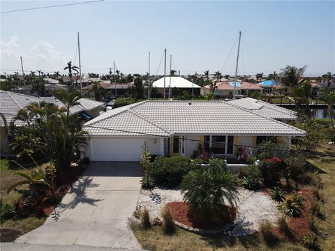 PUNTA GORDA ISLES - REDUCED! WOW! Lots of space with a tropical and beachy feel! You will enjoy a WATERVIEW from almost every room when you enter this lovely 3/3/2 pool home on SAILBOAT WATER with 120 FEET OF SEAWALL! Boating is easy as you are JUST ...