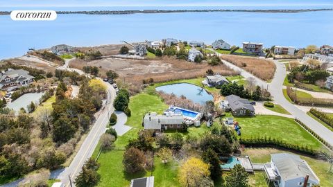 Discover 9 Tanners Neck Lane in Westhampton, where luxury meets coastal charm in this stunningly renovated beach house. Featuring an inviting open floor plan, with seamless indoor-outdoor living, this home is perfect for entertaining. Step into the u...