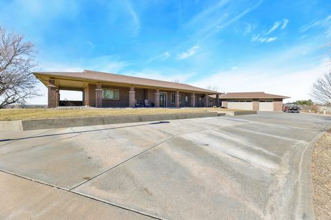 Buhler Road Retreat provides the ultimate in luxury, room to spread your elbows and picturesque views of famed Kansas sunrises and sunsets. The 4722 square foot home sits behind an automatic security gate and is located on +/-78 serene acres, featuri...