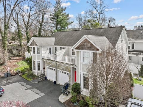 Luxurious townhouse with a serene tiered garden, waterfall, and Koi Pond. Elegant living space with gas fireplace, French doors leading to secluded sanctuary. Expansive primary suite with cathedral ceilings, walk-in closet, lavish primary bath. Secon...